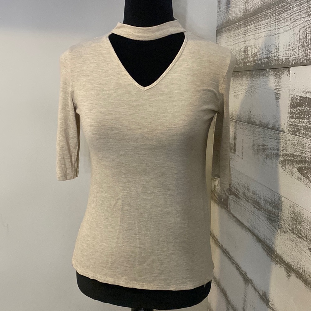 Cream colored quarter sleeve choker top